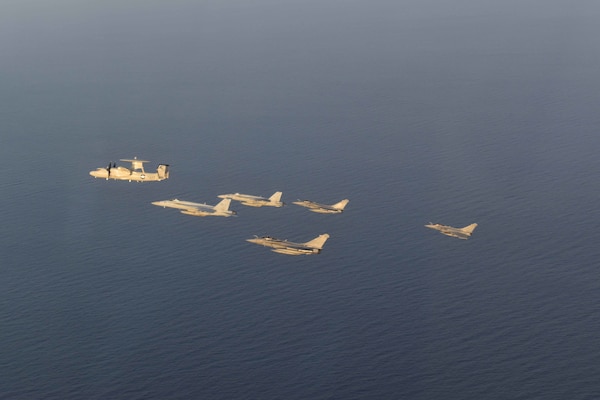 210413-N-NO712-1235 ARABIAN SEA (April 13, 2021) - U.S. Navy F/A-18F and F/A-18E Super Hornet fighter jets, an E-2C Hawkeye tactical airborne early warning aircraft and French Marine Nationale Dassault Rafale fighter jets fly in formation during dual carrier operations between the aircraft carriers USS Dwight D. Eisenhower (CVN 69) and FS Charles de Gaulle (R 91) in the Arabian Sea, April 13. The Eisenhower Carrier Strike Group is deployed to the U.S. 5th Fleet area of operations in support of naval operations to ensure maritime stability and security in the Central Region, connecting the Mediterranean and Pacific through the western Indian Ocean and three strategic choke points. (U.S. Navy Photo)