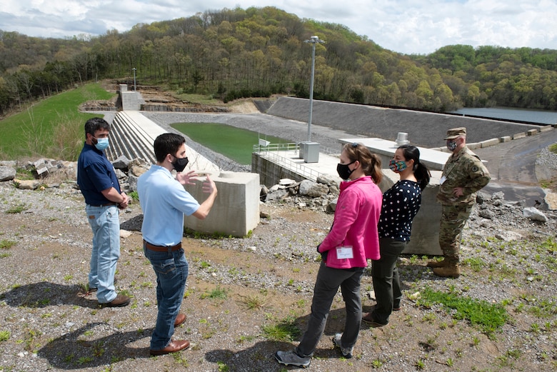 Anthony Rodino (Second from Left), U.S. Army Corps of Engineers Nashville District Water Management Section chief, leads regional first responders on a tour of the saddle dam near Center Hill Dam in Lancaster Tennessee, April 8, 2021 during First Responders Day, an event where regional first responders work through an exercise scenario to communicate and facilitate awareness. Rodino also showed this tour group the recently constructed roller compacted concrete berm. The tour made it possible for participants to have an awareness of the facilities and area landscape. (USACE photo by Lee Roberts)