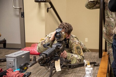 Soldier with 2-325, 82nd Airborne Division bore sighting the Family of Weapons Sight – Crew Served to the M-249 Medium Machine Gun during a Soldier Touchpoint in Fort Benning, GA.