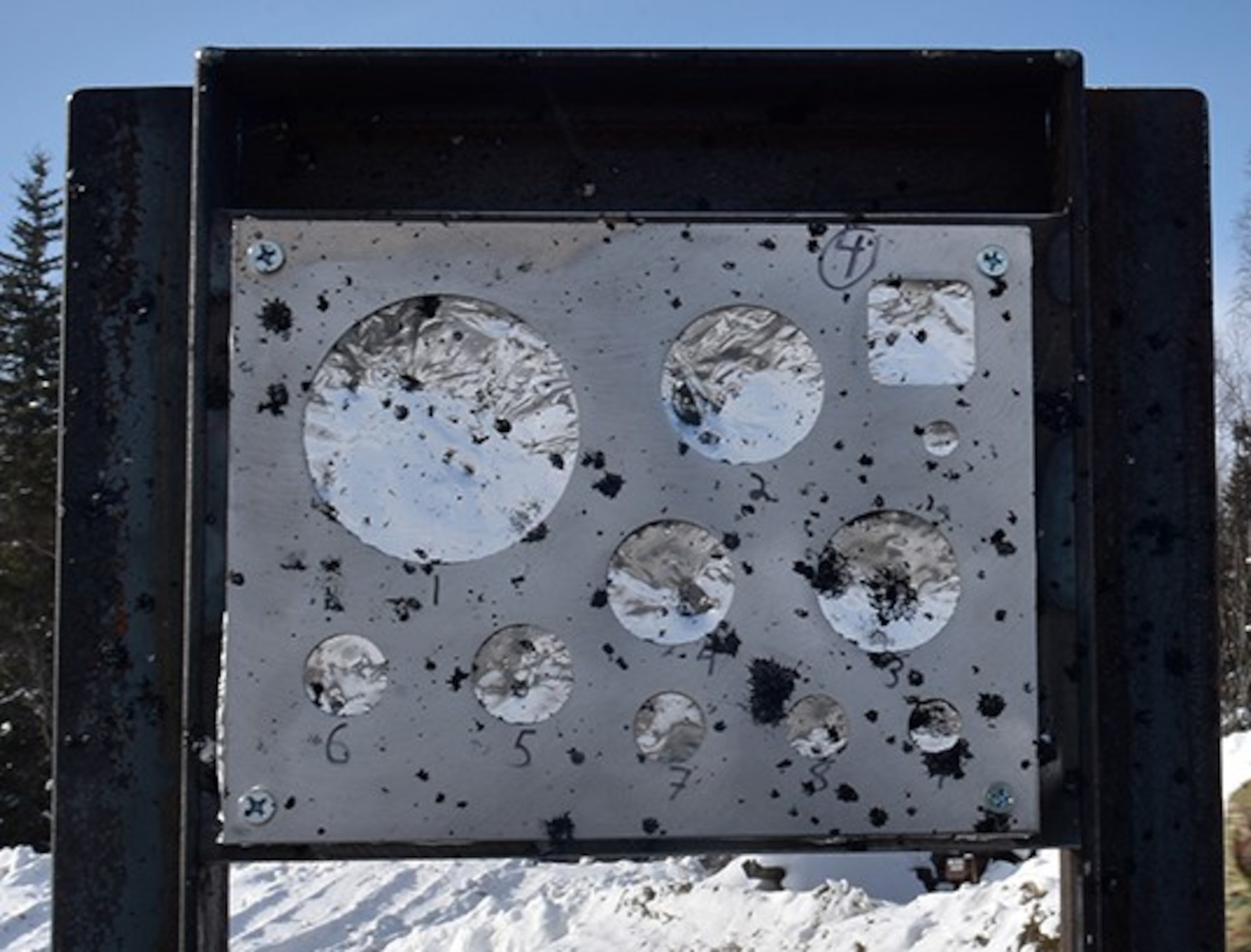 A gauge stand measures the effect of an explosion during the snow mitigation test on March 18, 2021, at Eielson Air Force Base, Alaska. The foil pieces are used to measure the blast caused by the explosion. (U.S. Air Force photo/Senior Airman Danielle Sukhlall)