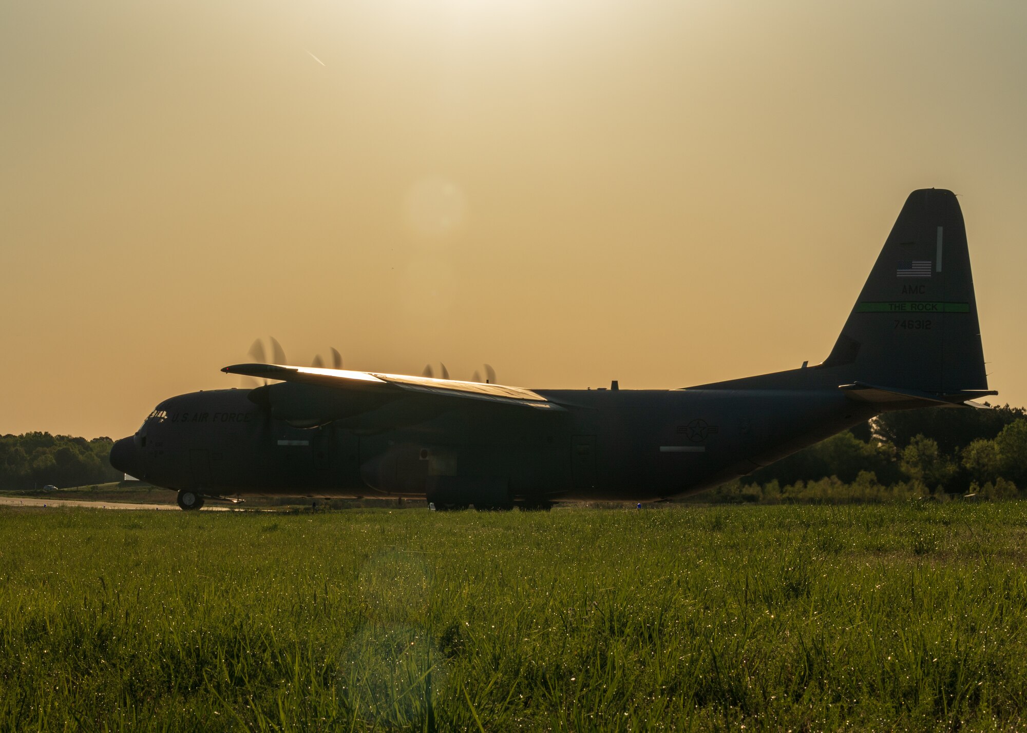A U.S. Air Force C-130J Super Hercules lines up on the taxi way as part of an 11-ship formation from Little Rock Air Force Base, Ark., April 15. 2021. The elephant walk quickly launched combat airlift to support an U.S. Army Joint Readiness Training event. (U.S. Air Force photo by Maj. Ashley Walker)
