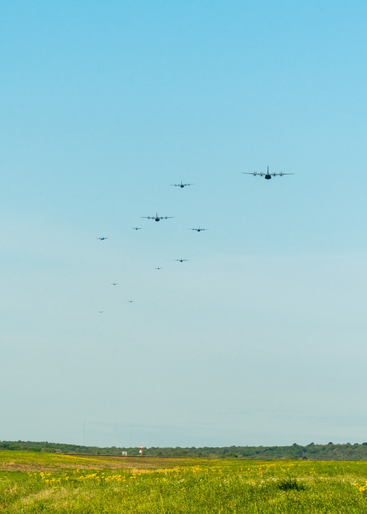 U.S. Air Force active duty and Reserve personnel take-off in a C-130J Super Hercules 11-ship formation from Little Rock Air Force Base, Ark., April 15. 2021. The elephant walk quickly launched combat airlift to support an U.S. Army Joint Readiness Training event. (U.S. Air Force photo by Maj. Ashley Walker)