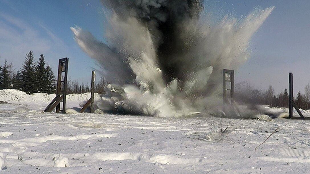 U.S. Air Force Airmen from the 354th Civil Engineer Squadron Explosive Ordnance Disposal (EOD) flight, the Iceman Spark Innovation team, Air Force Reach Laboratory innovation team, and other partners set off an explosion for the EOD snow mitigation test on March 18, 2021, at Eielson Air Force Base, Alaska. The experiment tested the use of snow to mitigate the damaging effects of explosions in an arctic environment. (U.S. Air Force photo/Senior Airman Danielle Sukhlall)