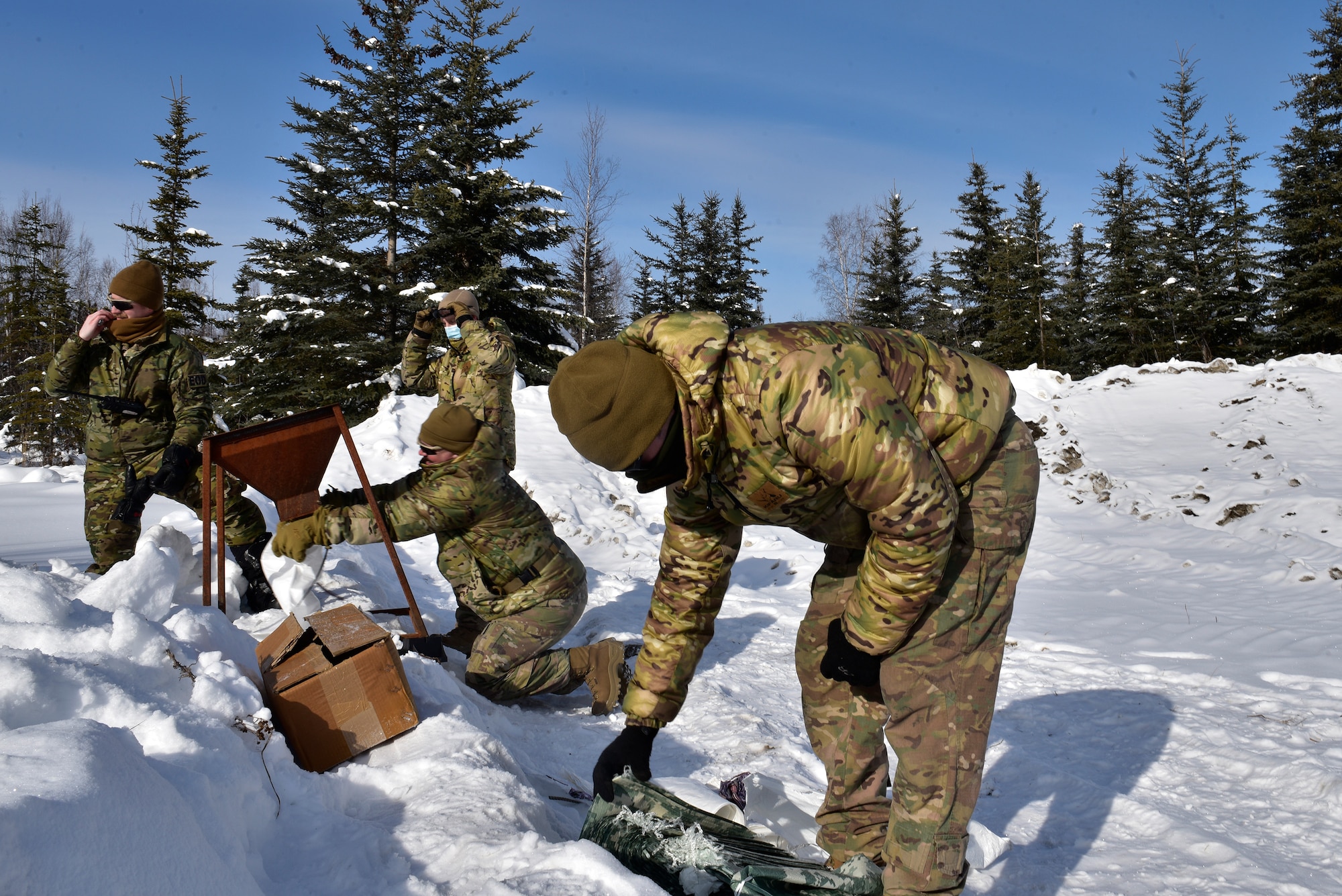 U.S. Air Force Airmen from the 354th Civil Engineer Squadron Explosive Ordnance Disposal (EOD) Flight prepare bags for the snow mitigation experiment on March 18, 2021, at Eielson Air Force Base, Alaska. The experiment tested the use of snow to help mitigate explosive effects. Because of Alaska’s arctic environment, the usual method of using water to reduce blast wave peak pressures is often impractical. Therefore, Icemen Spark and EOD sought to use a more readily available material: snow. (U.S. Air Force photo/Senior Airman Danielle Sukhlall)