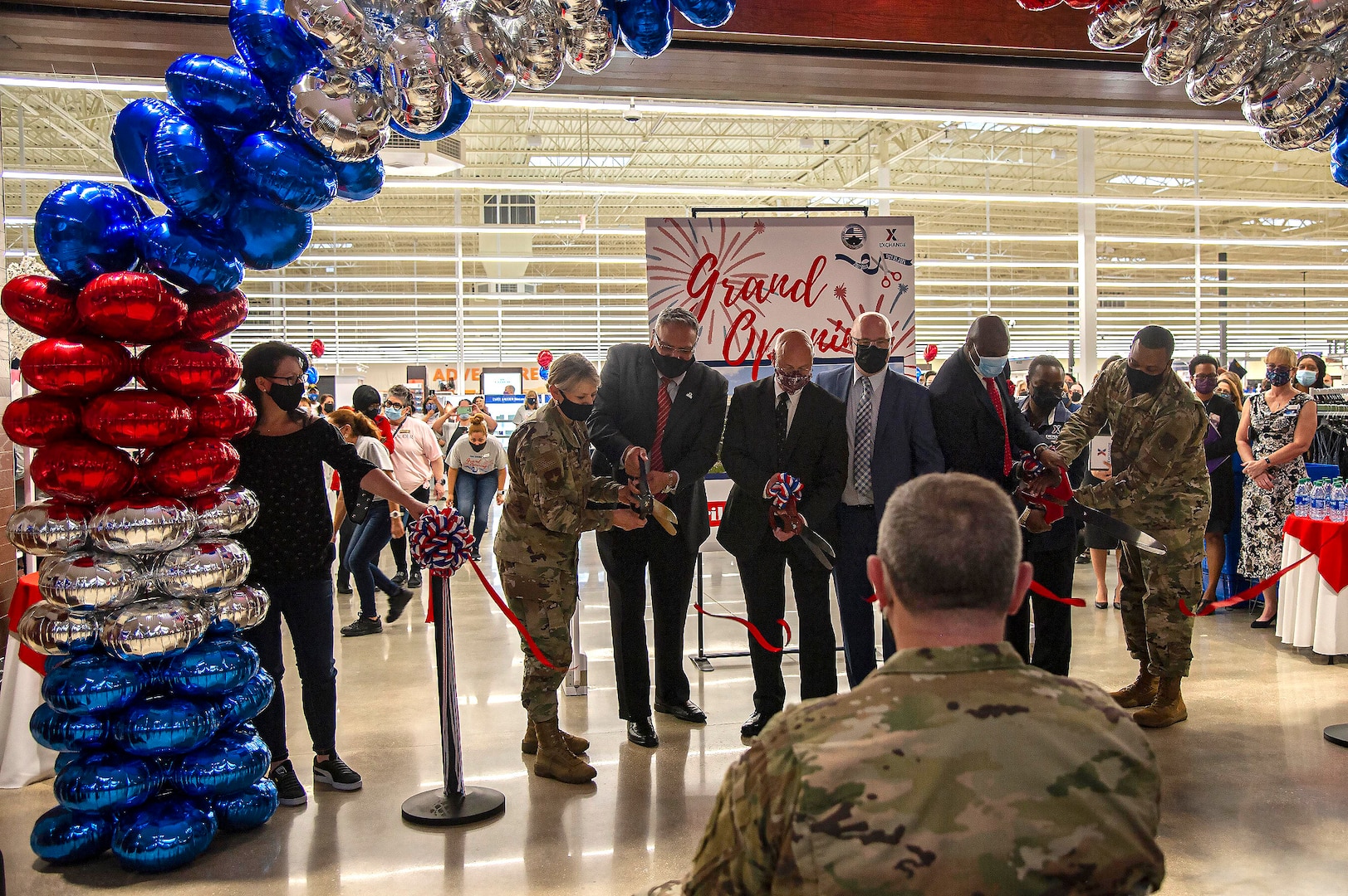Cutting the ribbon on the new Exchange shopping center at Joint Base San Antonio-Fort Sam Houston April 15