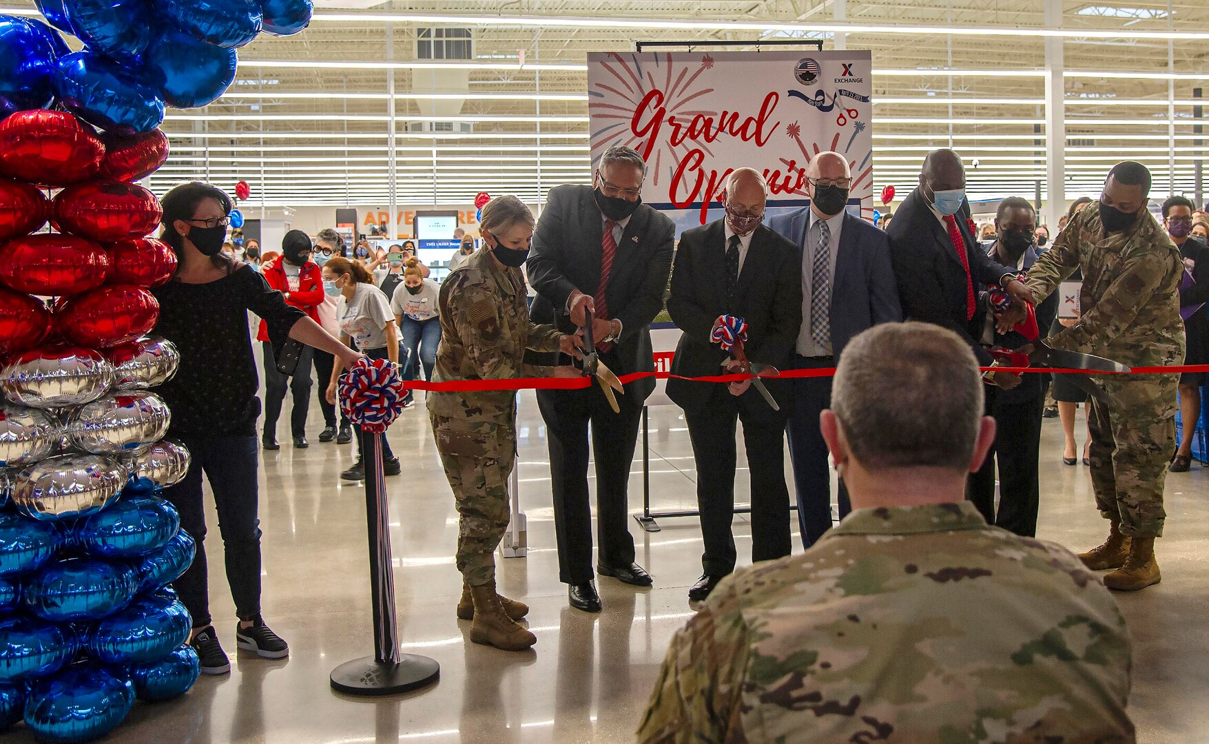 Cutting the ribbon on the Joint Base San Antonio-Fort Sam Houston Exchange shopping center April 15