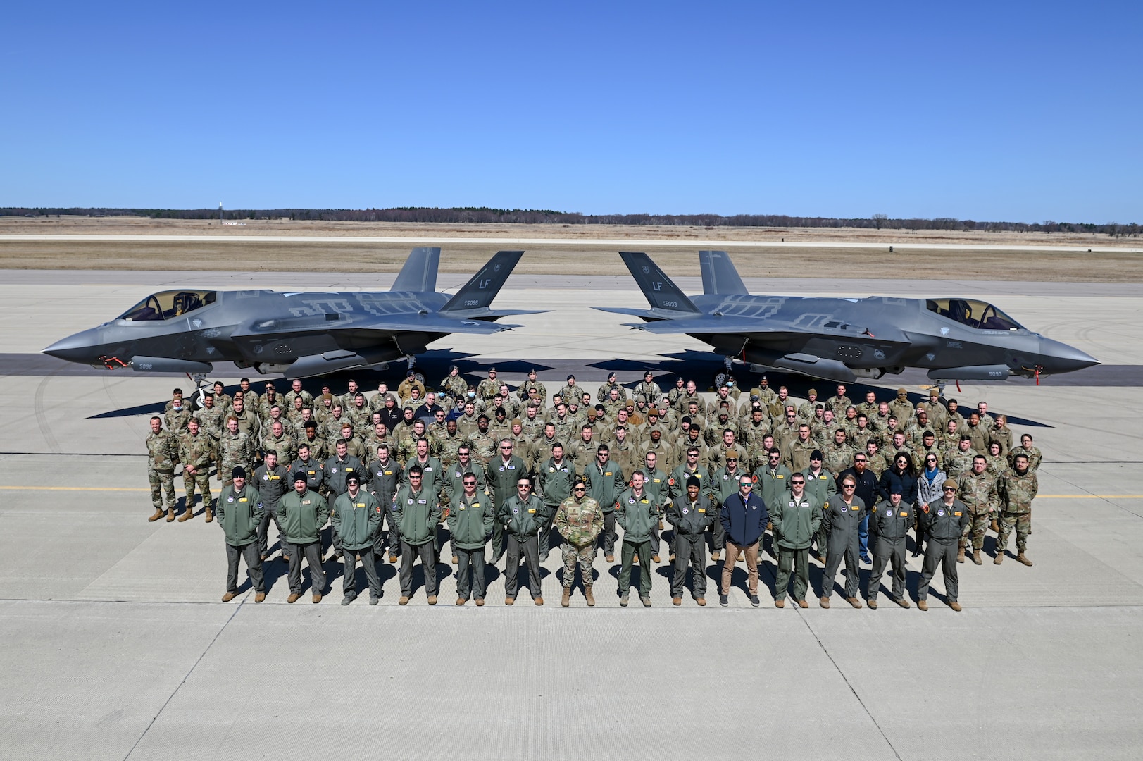 Members assigned to Luke Air Force Base, Arizona, stand together for a photo after the conclusion of Northern Thaw at Volk Field Air National Guard Base, Wisconsin, April 1, 2021.The two-week exercise total force exercise provided high-end combat training.