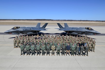 Members assigned to Luke Air Force Base, Arizona, stand together for a photo after the conclusion of Northern Thaw at Volk Field Air National Guard Base, Wisconsin, April 1, 2021.The two-week exercise total force exercise provided high-end combat training.