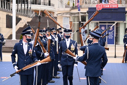 Members of the United States Air Force Honor Guard perform for the first time at National Harbor in Washington D.C. on March 25, 2021. 300 ceremonial guardsmen make up the official ceremonial unit of the United States Air Force,  serving a five-state area of responsibility and performing more than 3,000 missions per year. Missions involve honoring the President of the United States, Foreign Heads of State and senior Department of Defense and Air Force leaders; performing ceremonial guardsman duties for ceremonies for Presidential and Joint Service events; wreath-laying ceremonies at the Tomb of the Unknown and the Air Force Memorial; and carrying out military funeral honors at Arlington National Cemetery. (U.S. Air Force photo by Tech. Sgt. Darren Workman)