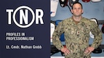 Lt. Cmdr. Nathan Grebb poses for a photo in a martial arts and training gym he co-owns.