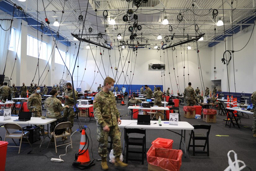 Pennsylvania National Guard members prepare the Esperanza Community Vaccination Center in North Philadelphia for community members on April 13, 2021.