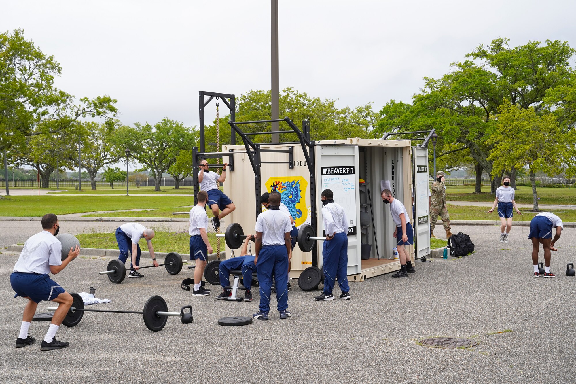 Airmen from the 336th Training Squadron exercise on a Beaver Fit Box at Keesler Air Force Base, Mississippi, April 10, 2021. The 81st Training Group acquired the Beaver Fit Boxes to provide more places for Airmen in training to work out while indoor gyms are operating at a limited capacity. (U.S. Air Force photo by Senior Airman Spencer Tobler)