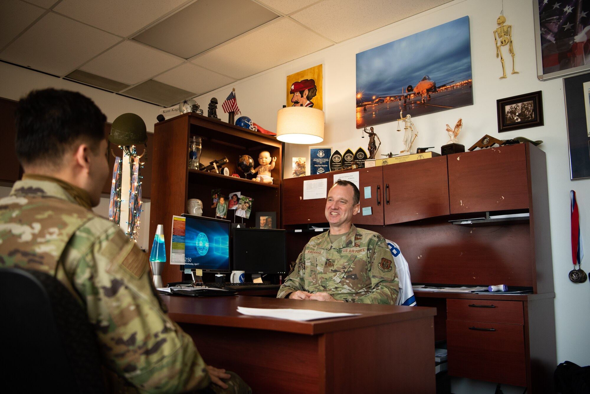 AF Reserve recruiter talks to an Airman.