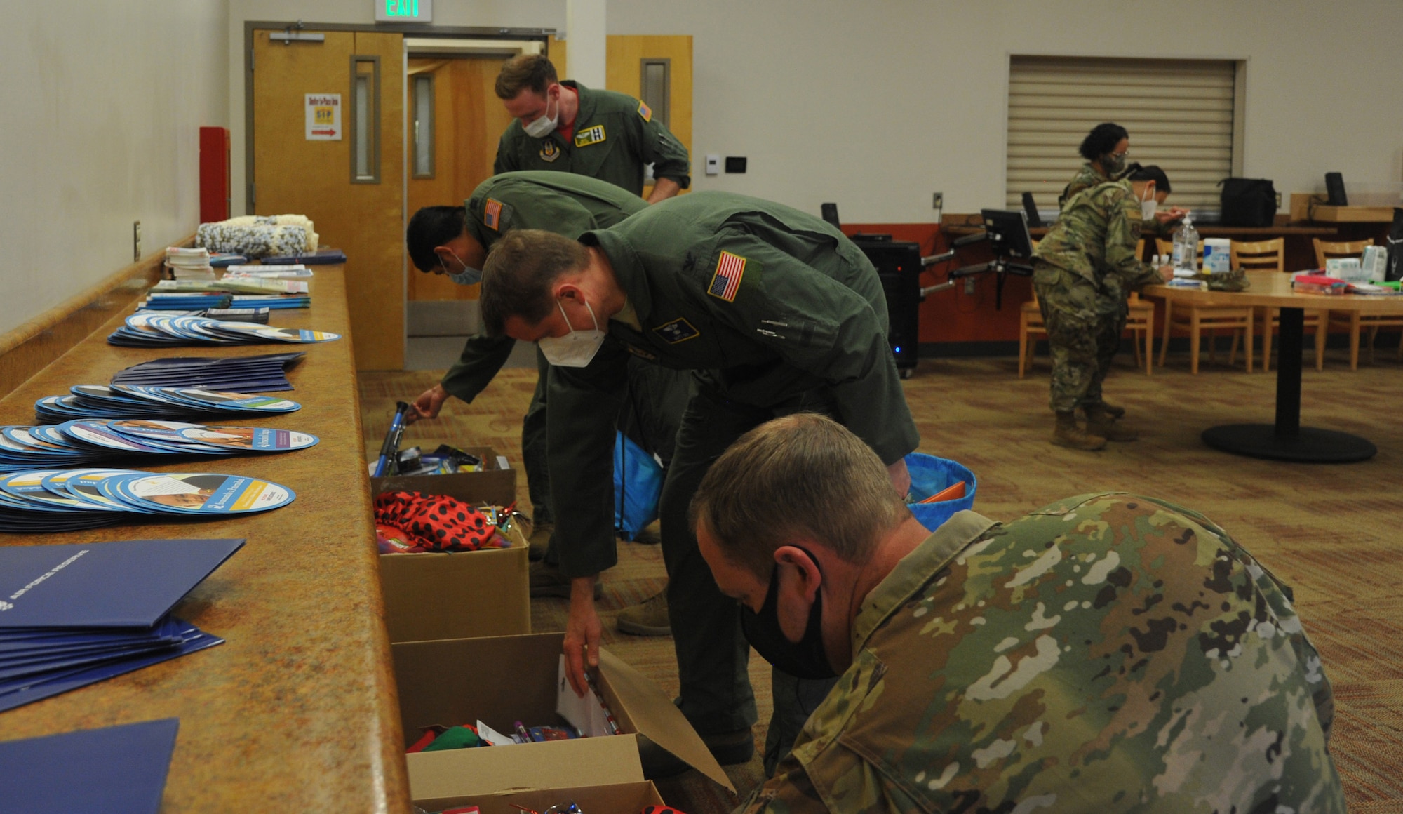 Reserve Citizen Airmen select toys for their children at the Baby Bundles + Kids for Kit event April 10 at Joint Base Lewis-McChord, Washington.