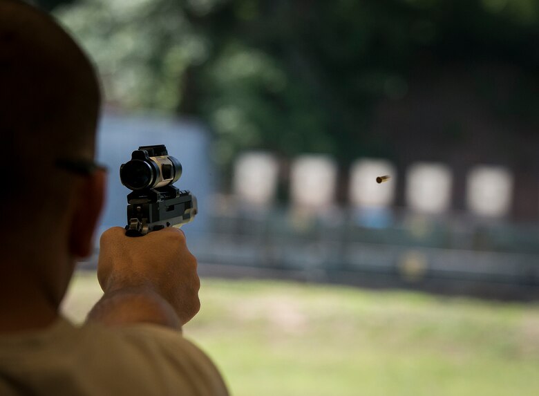 Staff Sgt. Jeremiah Jackson, a member of the U.S. Air Force Pistol Team, fires at his target during the .22 caliber match at the 2015 Interservice Pistol Championships at Fort Benning, Georgia. (U.S. Air Force photo/Staff Sgt. Andrew Lee)