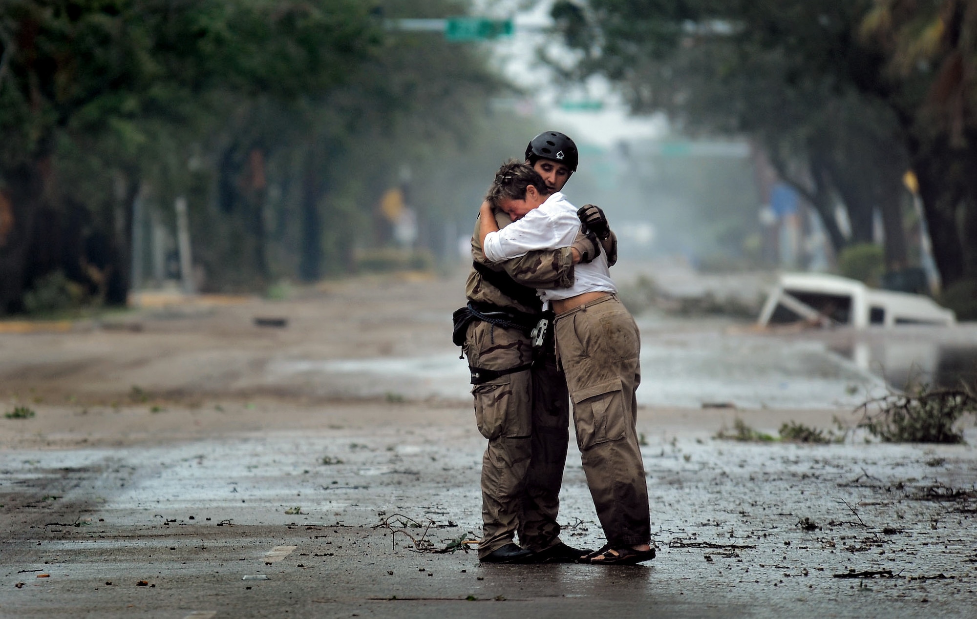 Pararescueman Staff Sgt. Lopaka Mounts receives a hug from a Texas resident Sept. 13 during search and rescue operations after Hurricane Ike. Sergeant Mounts is assigned to the 331st Air Expeditionary Group at Randolph Air Force Base, Texas. (U.S. Air Force photo/Staff Sgt. James L. Harper Jr.)