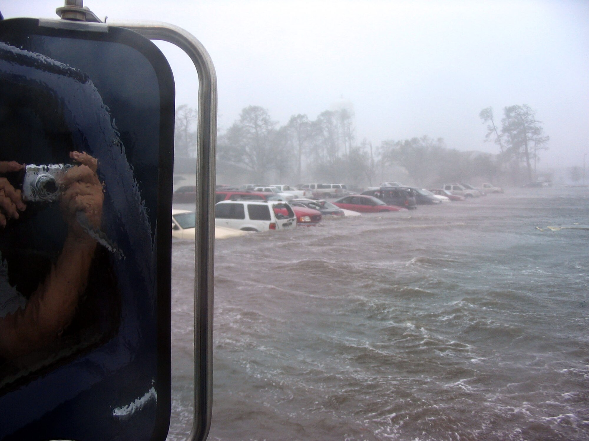 KEESLER AIR FORCE BASE, Miss. -- As Hurricane Katrina struck the base, rising waters swallowed parked cars.  The base and the 6,000 sheltered military students, permanent party, civilians and their families survived the Category 4 hurricane with no casualties.  The initial damage was catastrophic to base infrastructure.  The base is currently in the assessment and recovery stage.  (U.S. Air Force photo)