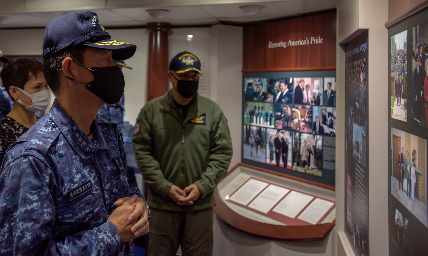 210415-N-WS494-1103 YOKOSUKA, Japan (April 15, 2021) Vice Adm. SAITO Akira, commander of Japan Maritime Self-Defense Force (JMSDF) Fleet Escort Force, receives a tour of the ship’s museum from  Capt. Fred Goldhammer, commanding officer, aboard the U.S. Navy’s only forward-deployed aircraft carrier USS Ronald Reagan (CVN 76). Carrier Strike Group (CSG) 5 and Task Force 71 met with the commander of JMSDF Fleet Escort Force aboard Ronald Reagan for ship tour and staff discussions. Ronald Reagan, the flagship of CSG 5, provides a combat-ready force that protects and defends the United States, as well as the collective maritime interests of its allies and partners in the Indo-Pacific region. (U.S. Navy Photo by Mass Communication Specialist 3rd Class Quinton A. Lee)