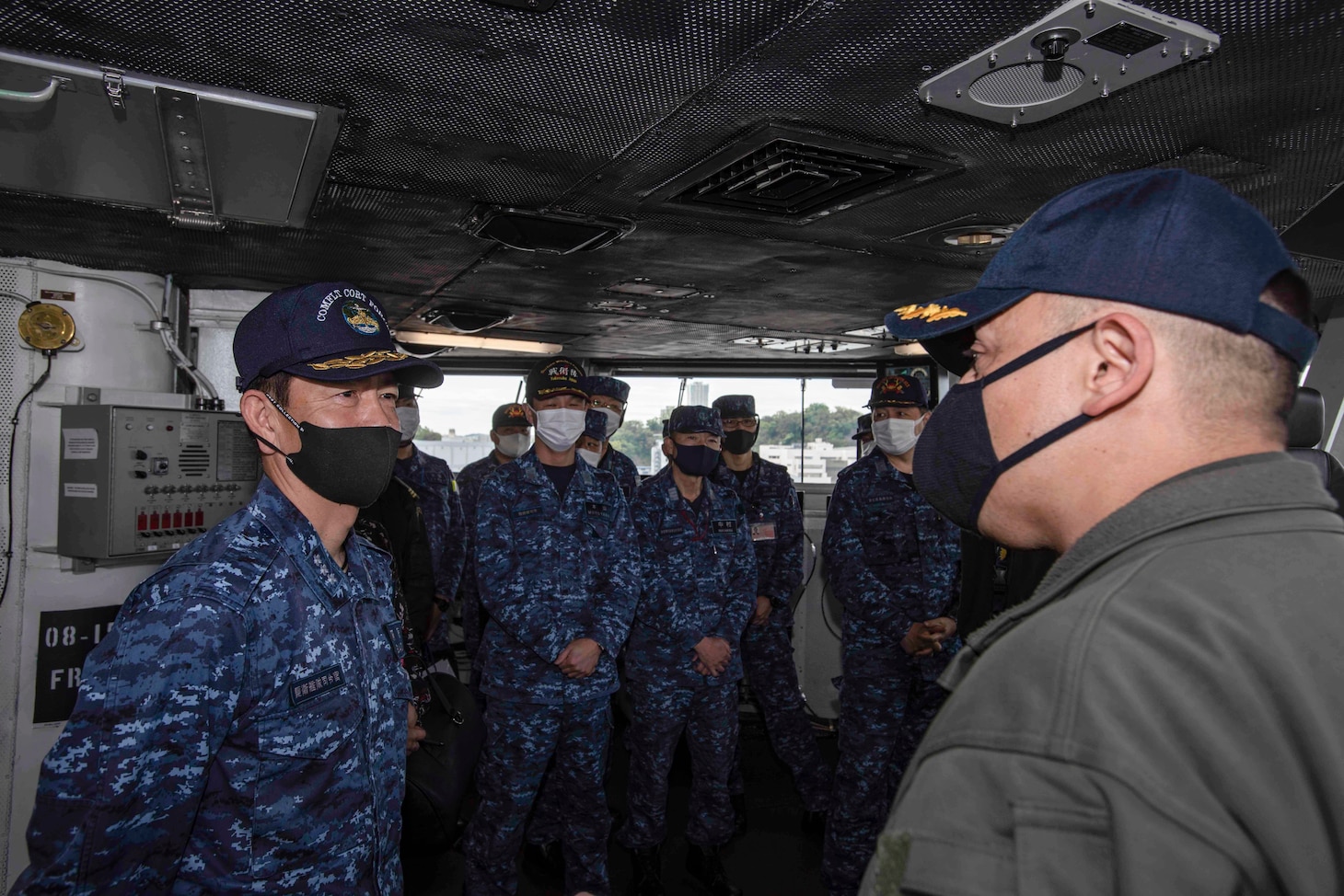 210415-N-WS494-1167 YOKOSUKA, Japan (April 15, 2021) Vice Adm. SAITO Akira, commander of Japan Maritime Self-Defense Force (JMSDF) Fleet Escort Force, receives a tour of the pilot house from Capt. Fred Goldhammer, commanding officer of the U.S. Navy’s only forward deployed aircraft carrier USS Ronald Reagan (CVN 76). Leadership from the 7th Fleet task forces that command Carrier Strike Group (CSG) 5 and Task Force 71 met with the commander of JMSDF Fleet Escort Force aboard Ronald Reagan for a ship tour and staff discussions. Ronald Reagan, the flagship of CSG 5, provides a combat-ready force that protects and defends the United States, as well as the collective maritime interests of its allies and partners in the Indo-Pacific region. (U.S. Navy Photo by Mass Communication Specialist 3rd Class Quinton A. Lee)