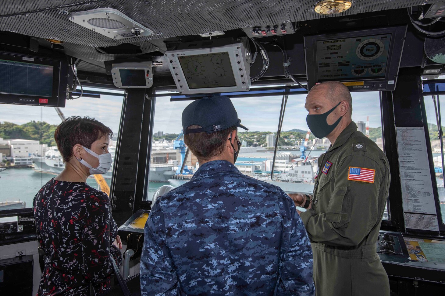 210415-N-WS494-1193 YOKOSUKA, Japan (April 15, 2021) Vice Adm. SAITO Akira, commander of Japan Maritime Self-Defense Force (JMSDF) Fleet Escort Force, and staff members, receive a tour of the primary flight control room from Cmdr. James Guimond, air officer of the U.S. Navy’s only forward deployed aircraft carrier, USS Ronald Reagan (CVN 76). Leadership from the 7th Fleet task forces that command Carrier Strike Group (CSG) 5 and Task Force 71 met with the commander of JMSDF Fleet Escort Force aboard Ronald Reagan for a ship tour and staff discussions. Ronald Reagan, the flagship of Carrier Strike Group 5, provides a combat-ready force that protects and defends the United States, as well as the collective maritime interests of its allies and partners in the Indo-Pacific region. (U.S. Navy Photo by Mass Communication Specialist 3rd Class Quinton A. Lee)