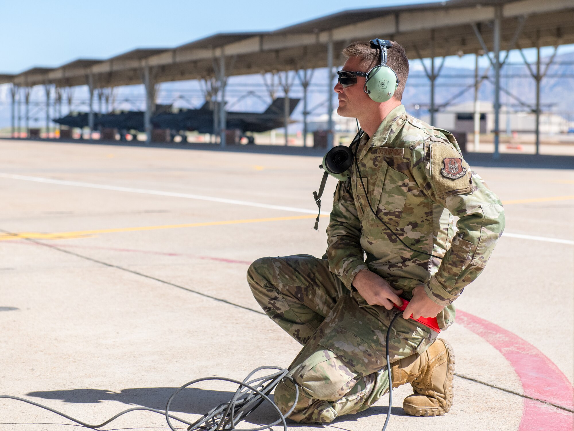 Senior Airman Thomas Rich, a crew chief in the 419th Aircraft Maintenance Squadron, signals to an F-35A Lightning II pilot during launch procedures April 10 at Hill Air Force Base, Utah.