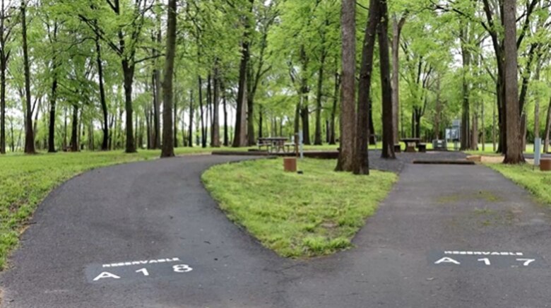 Parking spaces marked with A18 and A17 in front of camping and picnic areas.