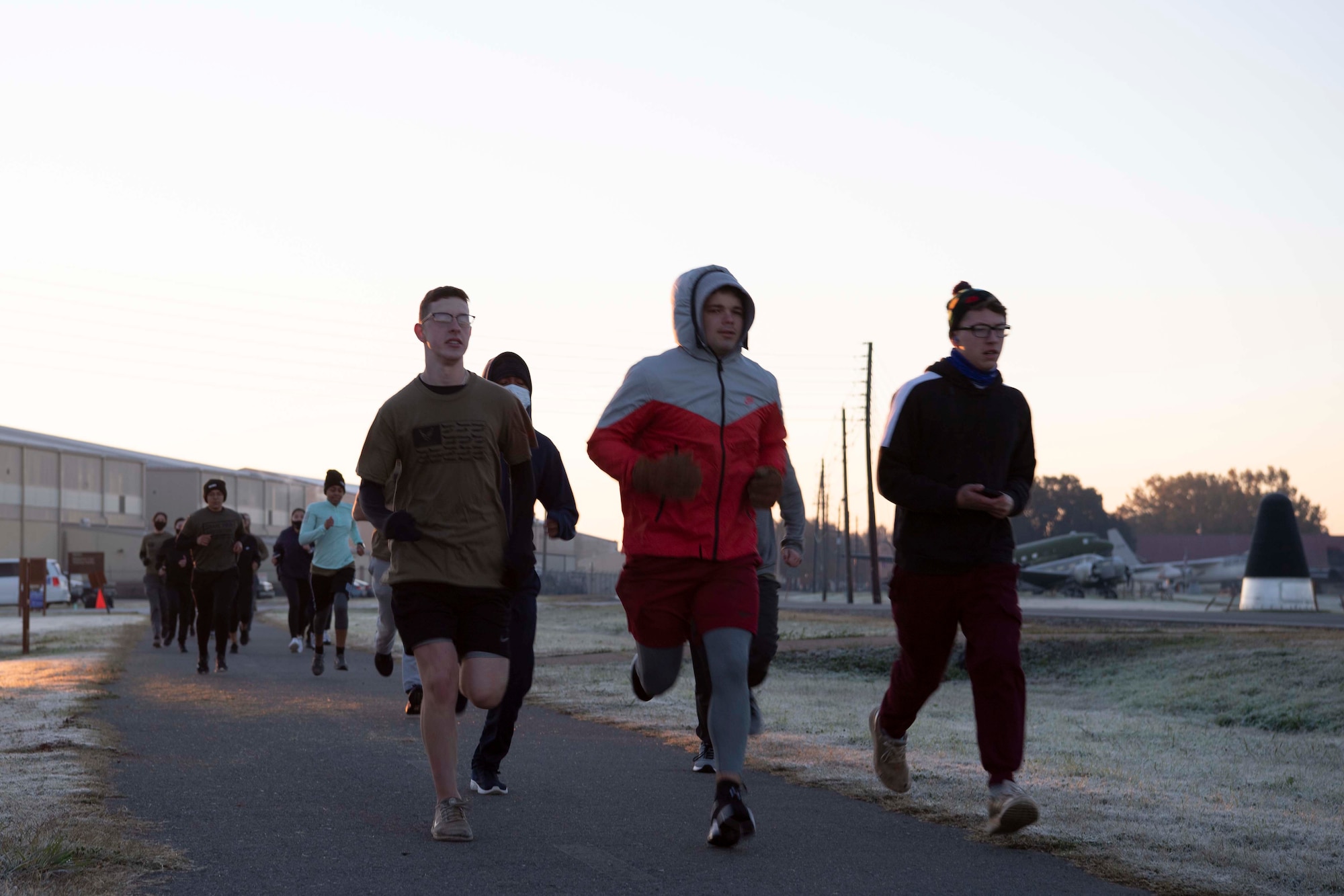 Photo of trainees running during sunrise