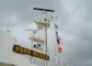 A photo of the mast of the Military Sealift Command hospital ship USNS Mercy (T-AH 19) with underway pennants.