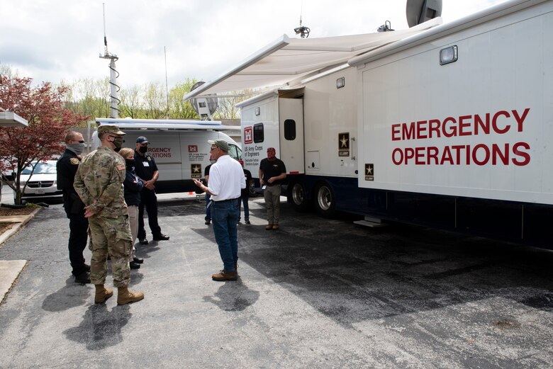 Jerry Breznican (White Shirt), U.S. Army Corps of Engineers Nashville District chief of Emergency Management, highlights how the district manages and operates Emergency Command and Control Vehicles that can be utilized when available during an emergency response to first responders April 8, 2021 at Center Hill Dam in Lancaster, Tennessee. The group participated in First Responders Day, an event where regional first responders work through an exercise scenario to communicate and facilitate awareness. (USACE Photo by Lee Roberts)