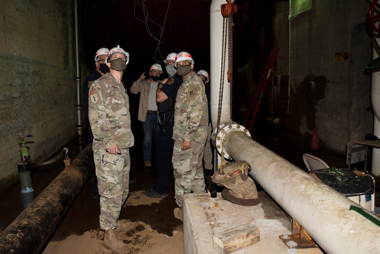 Jody Craig (Center Pointing), U.S. Army Corps of Engineers Nashville District powerplant superintendent at Center Hill Dam, leads regional first responders on a tour of the hydropower plant in Lancaster Tennessee, April 8, 2021 during First Responders Day, an event where regional first responders work through an exercise scenario to communicate and facilitate awareness. The tour made it possible for participants to have an awareness of the facilities and area landscape. (USACE photo by Lee Roberts)