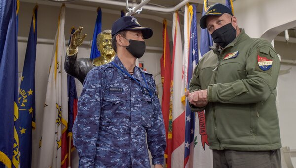 210415-N-WS494-1045 YOKOSUKA, Japan (April 15, 2021) Rear Adm. Will Pennington, commander, Task Force 70, greets Vice Adm. SAITO Akira, commander of Japan Maritime Self-Defense Force (JMSDF) Fleet Escort Force, on the ceremonial quarterdeck of the U.S. Navy’s only forward-deployed aircraft carrier, USS Ronald Reagan (CVN 76). Carrier Strike Group (CSG) 5 and Task Force 71 met with the commander of JMSDF Fleet Escort Force aboard Ronald Reagan for a ship tour and staff discussions. Ronald Reagan, the flagship of CSG 5, provides a combat-ready force that protects and defends the United States, as well as the collective maritime interests of its allies and partners in the Indo-Pacific region. (U.S. Navy Photo by Mass Communication Specialist 3rd Class Quinton A. Lee)