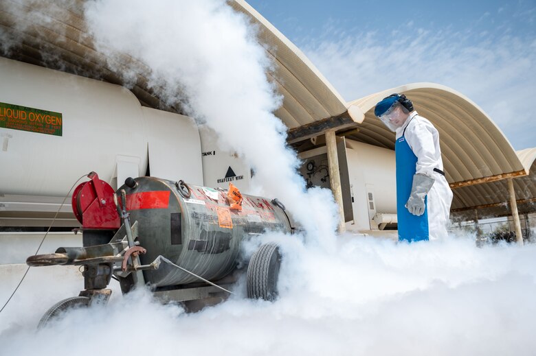Senior Airman Steven C. Rehana purges a liquid oxygen cart.
