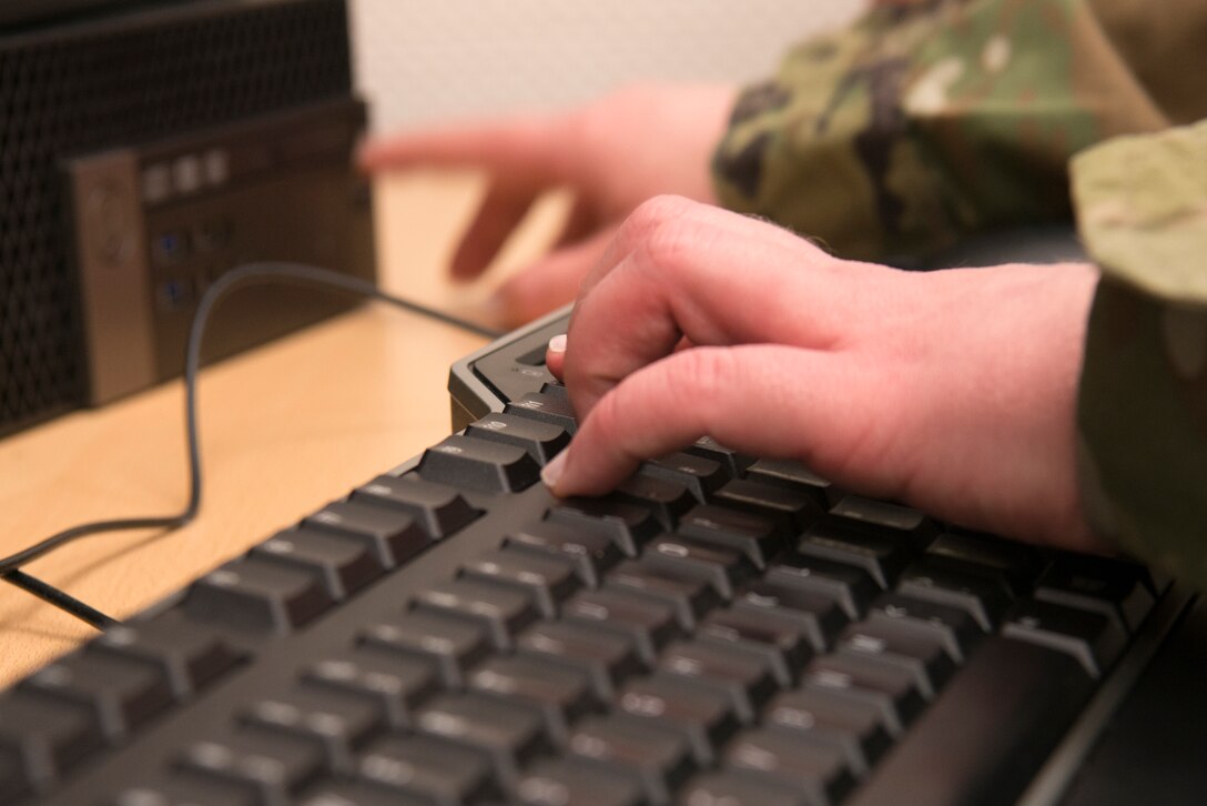 U.S. Air Force Tech. Sgt. Kaci Stephens, 86th Medical Support Squadron medical information services flight client support noncommissioned officer in charge, migrates medical information to a new network within the dental clinic at Ramstein Air Base, Germany, April 6, 2021.