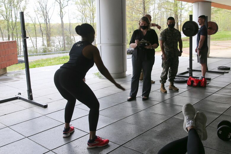 The Marine Corps Recruiting Command G-1 section participates in a Sexual Assault Prevention and Response awareness physical exercise at Marine Corps Base Quantico, Virginia, April 15, 2021. Zuzy Hall, the MCRC Sexual Assault Response Coordinator, and Staff Sgt. Angelica Pulliam, one of MCRC’s SAPR Victim Advocates, coordinated both a physical and a mental challenge for MCRC headquarters’ personnel to participate in during the month of April as part of the Marine Corps’ 17th Annual Sexual Assault Awareness and Prevention Month. The physical challenge coupled learning SAPR statistics with a set of exercises. For example, an American is sexually assaulted every 73 seconds. In recognition, personnel were challenged to complete 73 squats as part of the exercise. The physical challenge consisted of nine different exercises. (US Marine Corps photo by Cpl. Naomi May)