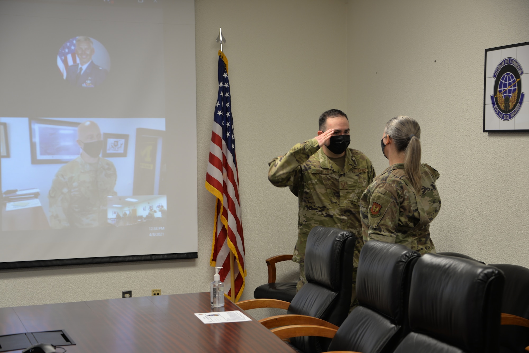 Airman saluting a commander.