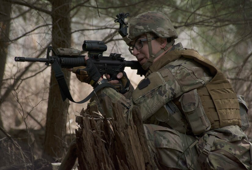 A Soldier from Bravo Company, 1st Battalion, 109th Infantry Regiment, 2nd Infantry Brigade Combat Team, communicate to his squad leader during battle drills at a training area in Williamsport on April 9, 2021. The Soldiers were tested with maintaining cohesion while engaging and moving through terrain. (U.S. Army photo by Sgt. 1st Class Matthew Keeler)