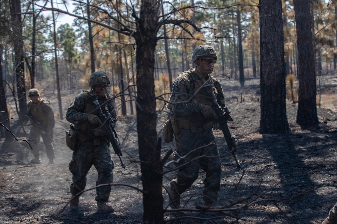 U.S. Marines with Alpha Company, 1st Battalion, 6th Marine Regiment (1/6), 2d Marine Division, advance to the next objective in a squad fire and maneuver training event on Camp Lejeune, N.C.,  April 7, 2021. Marines with 1/6 conducted the exercise to maintain proficiency in squad combat maneuvers and the ability to operate in adverse environments. The training showcased their abilities as an apex battalion task force. (U.S. Marine Corps photo by Lance Cpl. Jennifer E. Reyes)