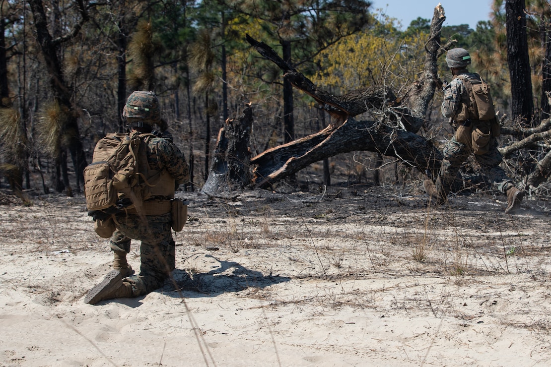 U.S. Marines with Alpha Company, 1st Battalion, 6th Marine Regiment (1/6), 2d Marine Division, buddy rush during a squad fire and maneuver training event on Camp Lejeune, N.C., April 7, 2021. Marines with 1/6 conducted the exercise to maintain proficiency in squad combat maneuvers and the ability to operate in adverse environments. The training showcased their abilities as an apex battalion task force. (U.S. Marine Corps photo by Lance Cpl. Jennifer E. Reyes)