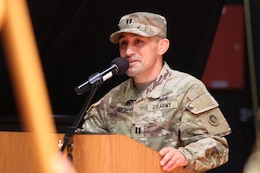 new commander speaks at podium