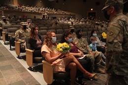 commander's wife receives yellow flowers