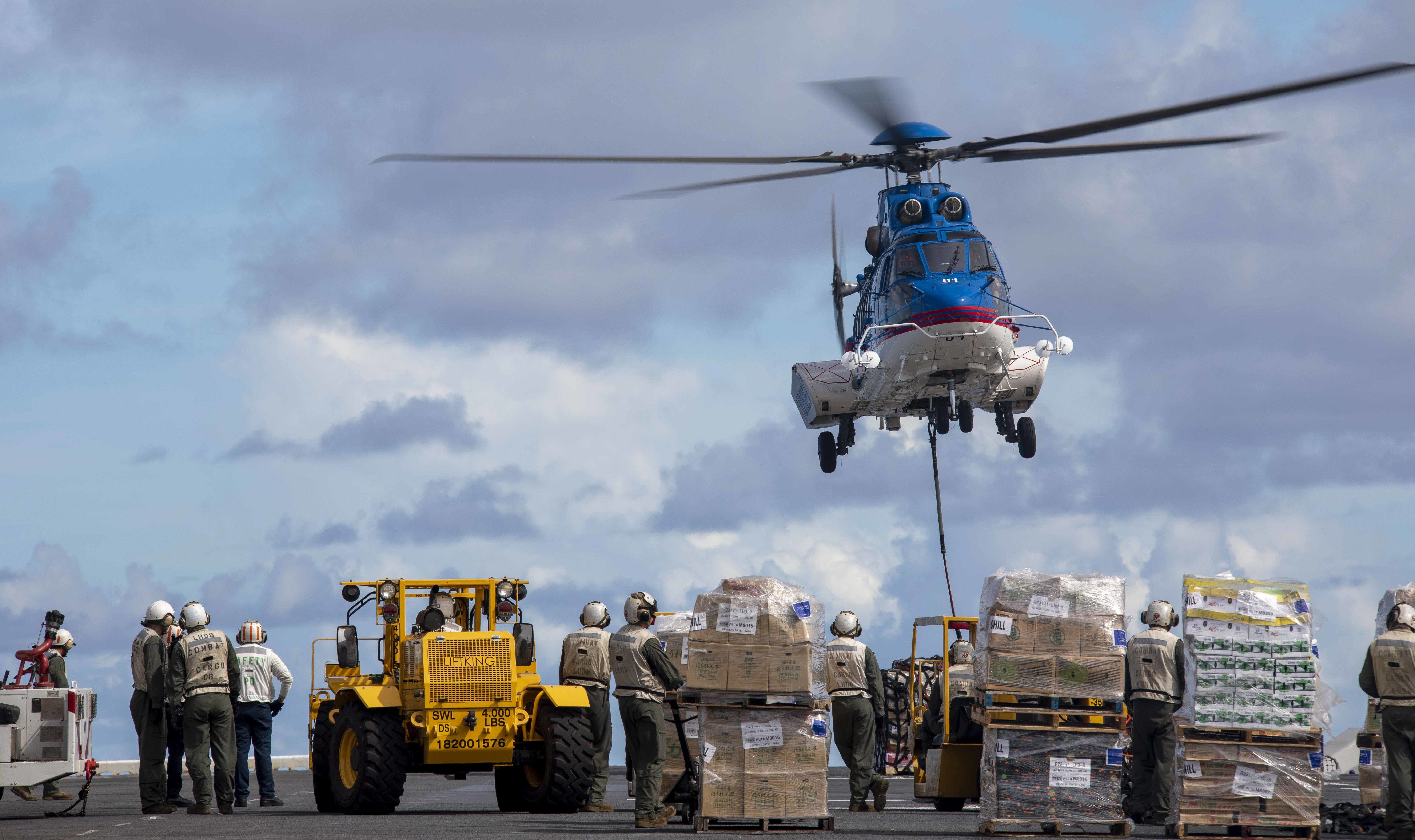 USS Makin Island (LHD 8) conducts a replenishment.
