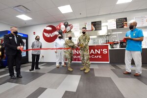 U.S. Air Force Col. Tracy Hunter, interim director of the Air Force Research Lab Sensors Directorate, and Col. Paul Burger, commander of the 88th Mission Support Group, cut a ribbon to open the Wingman’s Courtyard Café inside the Sensors Directorate at Wright-Patterson Air Force Base, Ohio on April 6, 2021.