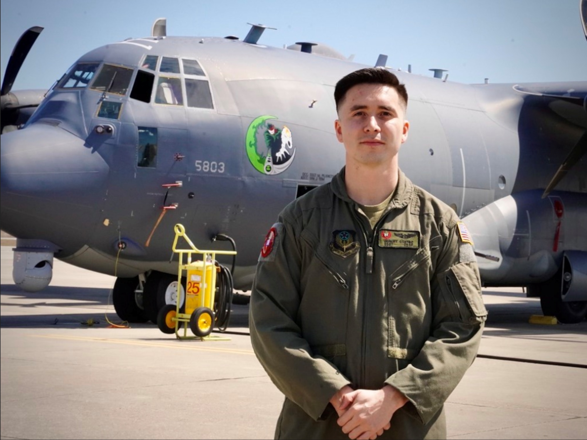 Staff Sgt. Jeremy Castro, 19th Special Operations Squadron special missions aviator poses in front of an AC-130J Ghostrider March 19, 2021, at Hurlburt Field, Florida.