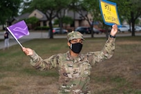 U.S. Air Force 2nd Lt. Allison Encarnacion, 637th Training Squadron executive officer, Defense Language Institute English Language Center, greets Lackland ISD school kids during the We Care Day event, April 15, 2021, at Joint Base San Antonio-Lackland, Texas.
