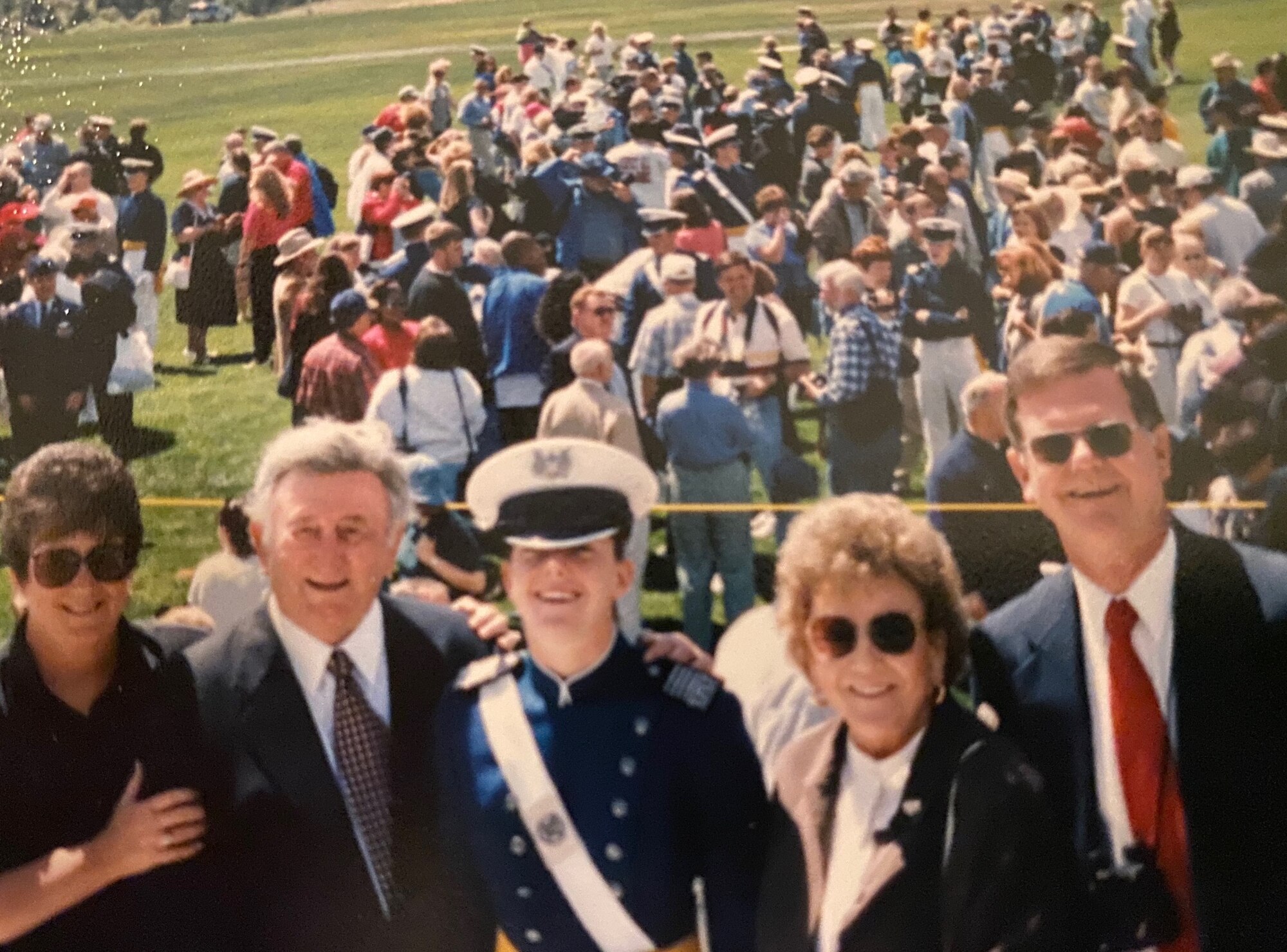 Family members gather following a cadet's graduation from the Air Force Academy.