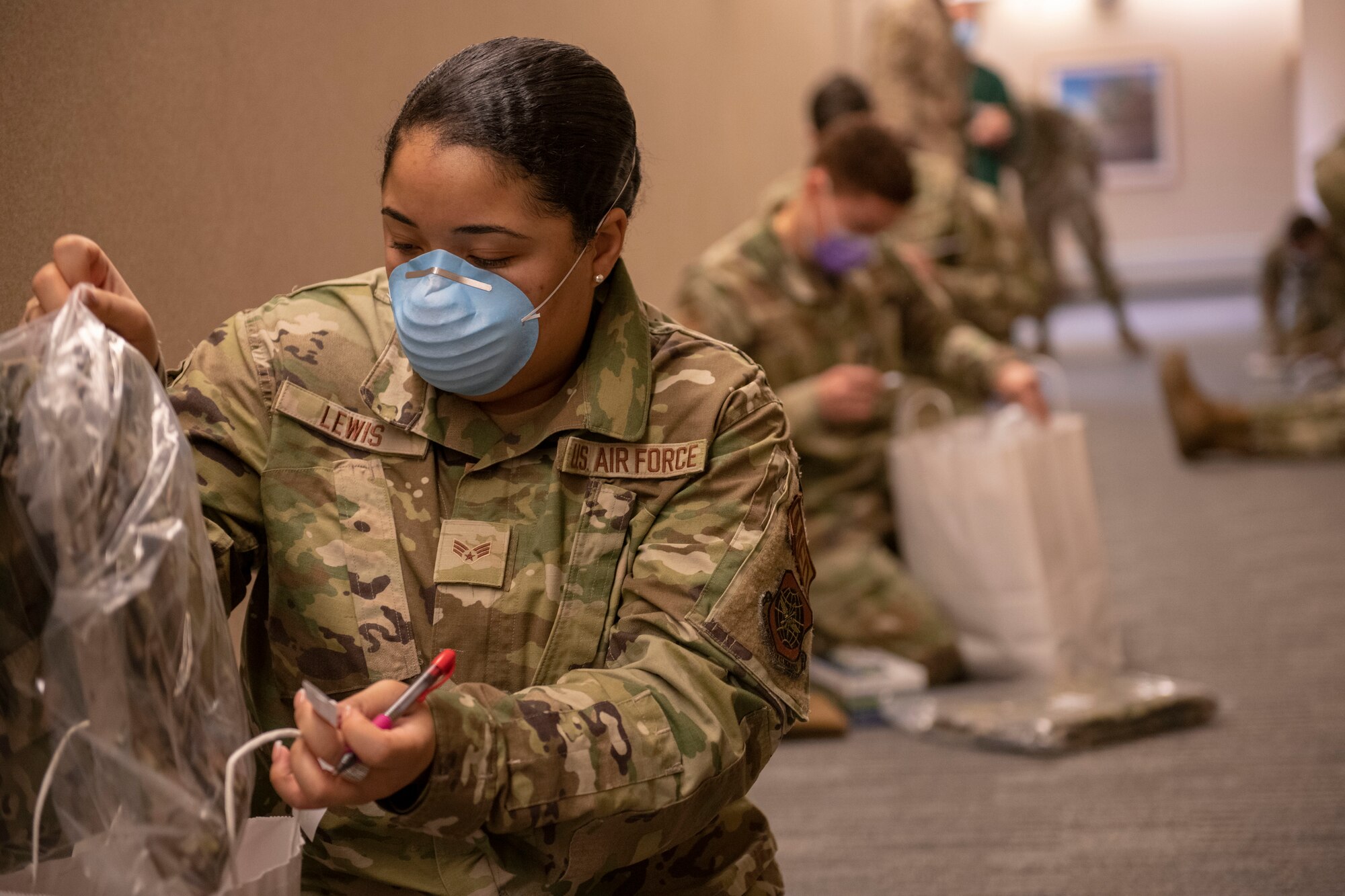 An Airman completes a deployment checklist