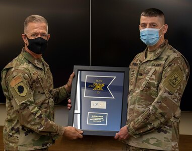 U.S. Army Col. Thomas Ransom (right) of Highland Park, Illinois, Illinois National Guard Inspector General (ILNG IG), receives an Illinois National Guard Inspector General Office Guidon.
