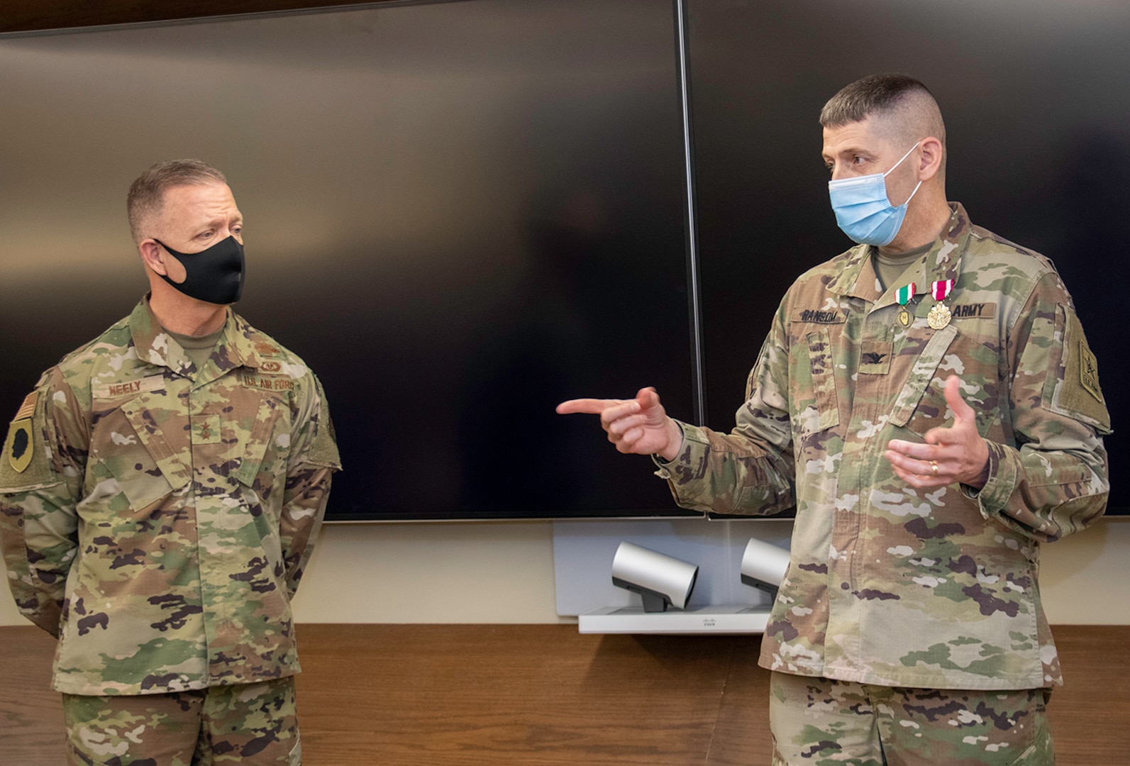 U.S. Army Col. Thomas Ransom, (right) of Highland Park, Illinois, Illinois National Guard Inspector General (ILNG IG), addresses attendees at his farewell ceremony April 9 at Camp Lincoln in Springfield, Illinois. Ransom, who has served as the ILNG IG since 2017, will head to Fort Shafter, Hawaii for his next military assignment as the Deputy Chief of Exercises.