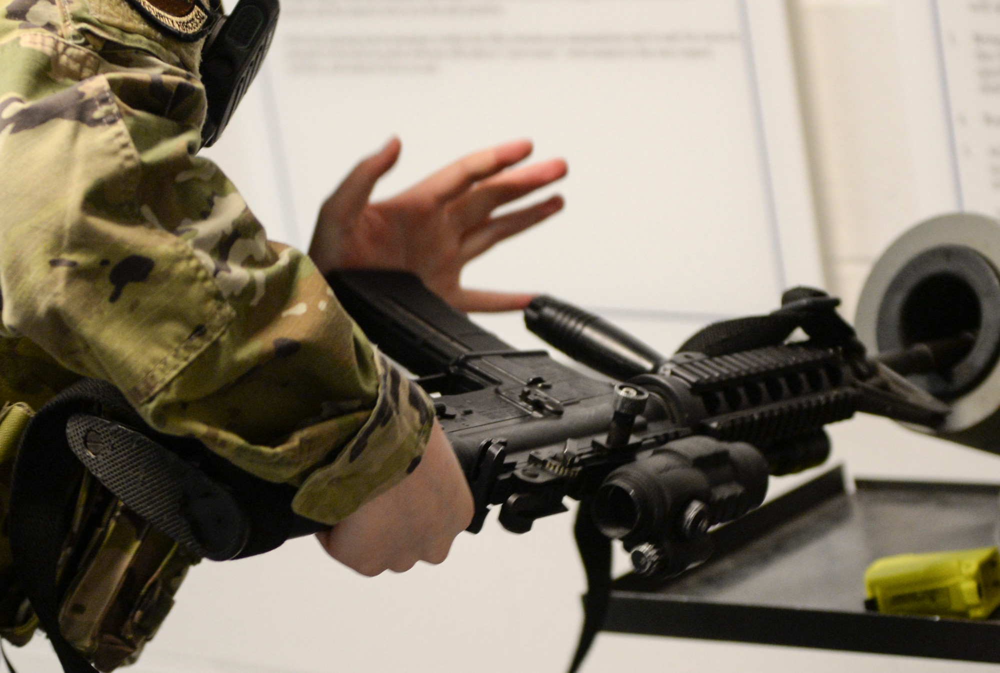 U.S. Air Force Airman 1st Class Iliana Arroyo, 88th Security Forces Squadron patrolman, loads a magazine into her M4 Carbine rifle, prior to going to her post at Wright-Patterson Air Force Base, Ohio, March 16, 2021. Security Forces members are responsible for providing base defense, as well as providing law enforcement on the installation. (U.S. Air Force photo by Wesley Farnsworth)