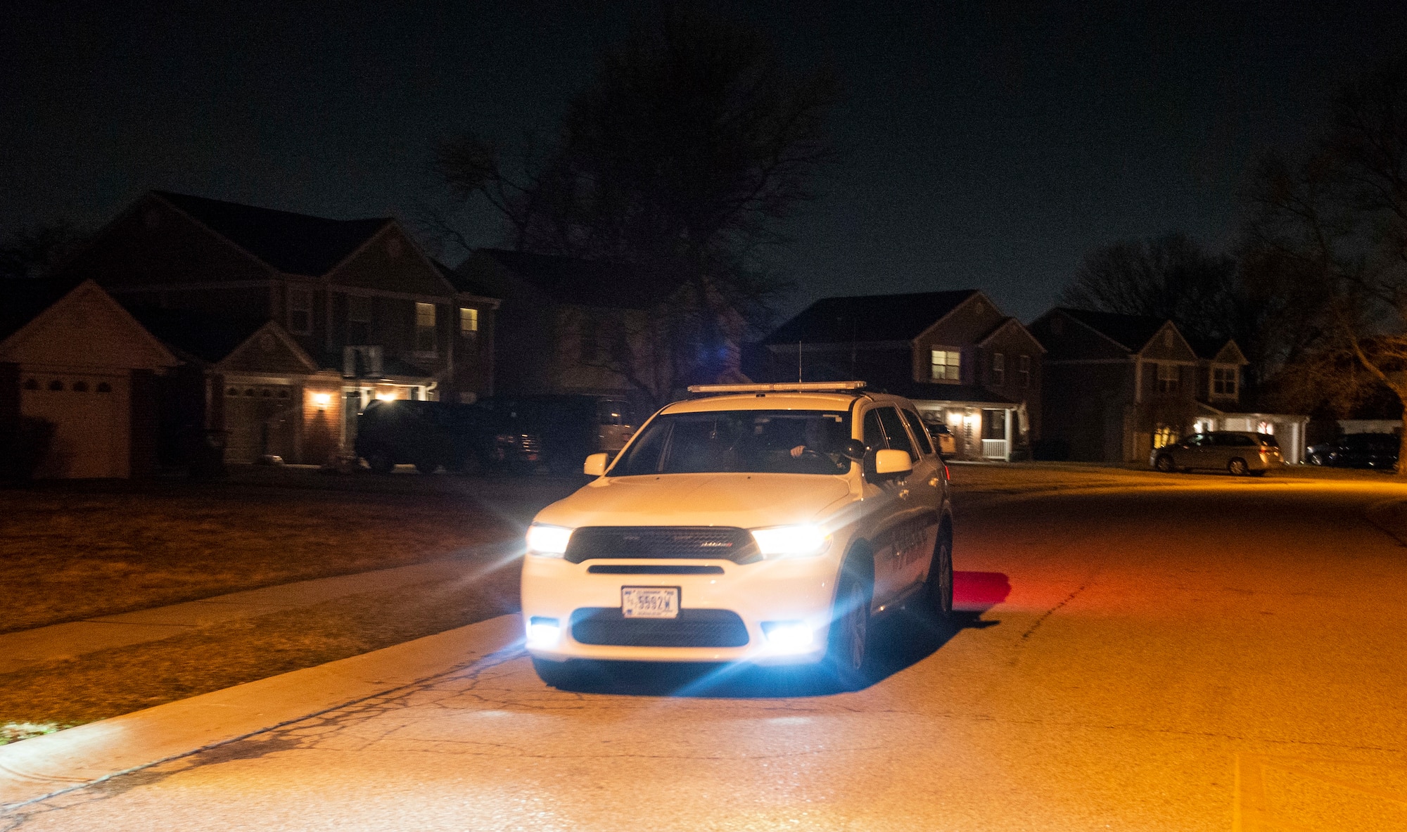 U.S. Air Force Senior Airman Aaron Benner, 88th Security Forces Squadron patrolman, conducts a drive-through patrol of base housing, March 16, 2021 at Wright-Patterson Air Force Base, Ohio. Security Forces members are responsible for providing base defense, as well as providing law enforcement on the installation. (U.S. Air Force photo by Wesley Farnsworth)